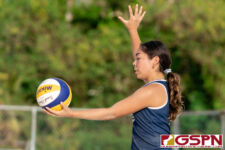 Harvest Eagle Trinity Terlaje gets ready for a serve to the St. John's Knights. (Photo by Michael Blas)